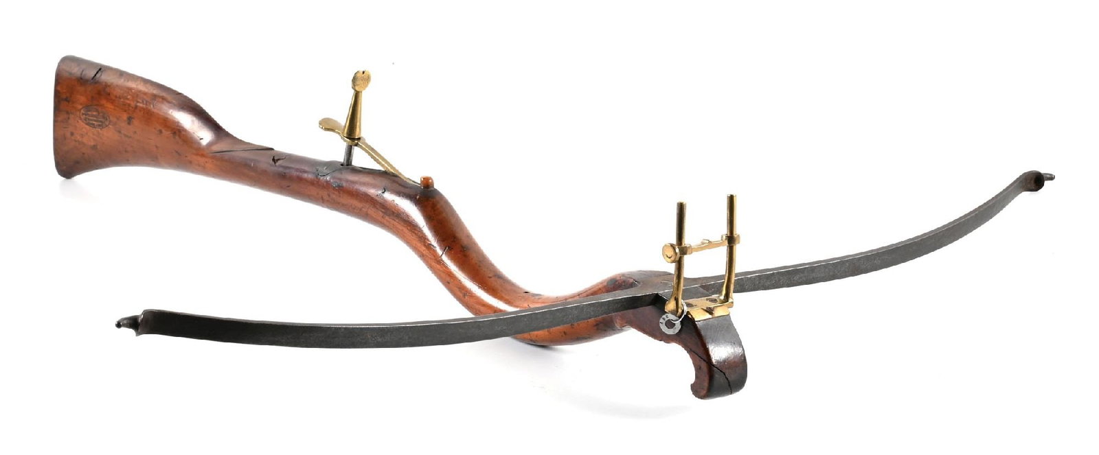FRENCH BULLET BOW.: Approximately 32" across the prod and 30" in length. Adjustable front sight of brass. Fixed rear sight on stand, with trip behind a horn (?) nut. Right side of stock with a French makers mark. Screw