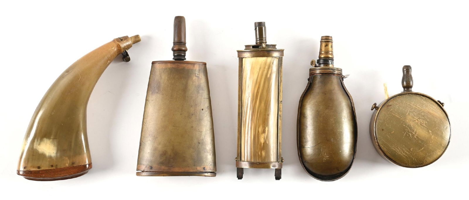 LOT OF 5: HORN POWDER FLASKS.: This is a very interesting lot of 19th century powder flasks made with horn. The first is of standard, flattened form with a sculpted wood plug. It measures a bit over 8" and sports an unusual spring