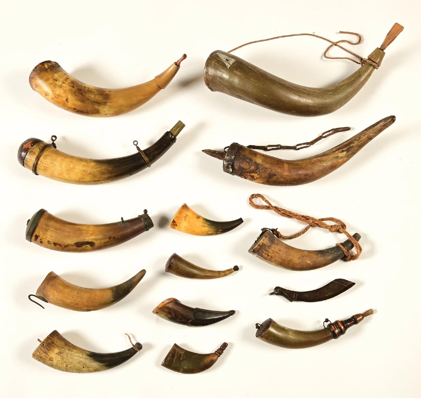 LOT OF 13: POWDER AND TOOL HORNS.: Measure from and measures from 5 to 15". Some have carvings. All are very good to fine condition. PROVENANCE: Ex. Castlerock Museum.
