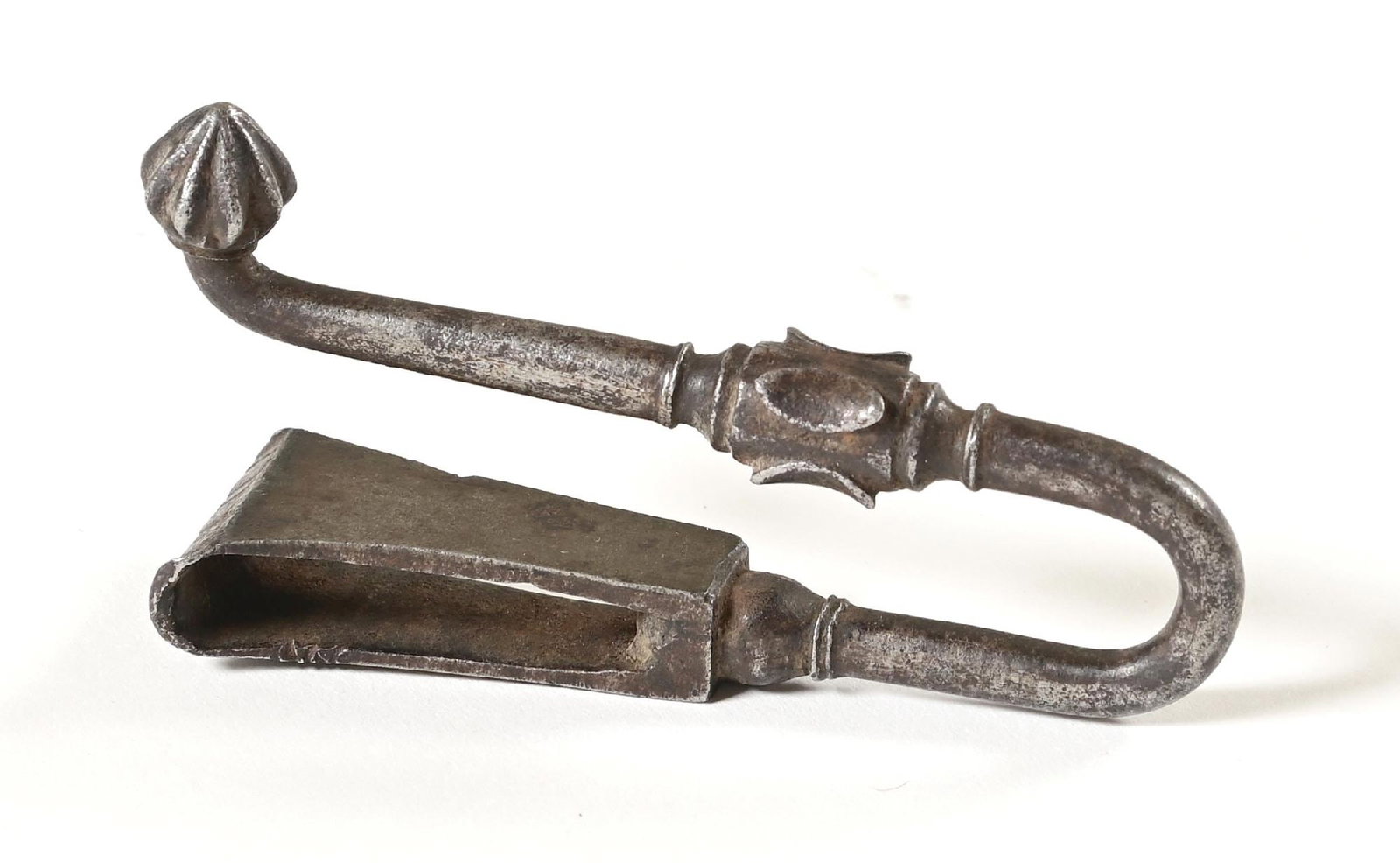 BELT HOOK, PROBABLY FRENCH.: For a close example dated to the 15th century, see The MET Museum, object number 2010.180.2, identified as French. Present example is somewhat more ornamental with faceted designs and finer work,