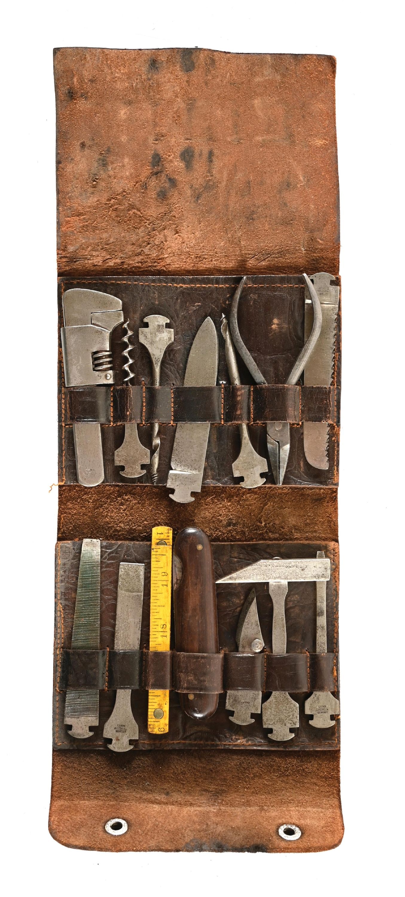 CROWN CUTLERY POCKET KNIFE TOOL KIT.: Appears complete with all tools marked "CROWN / CUTLERY Co / GERMANY". All pieces exhibit even gray patina with freckling throughout. Leather case remains supple but displays surface crazing and