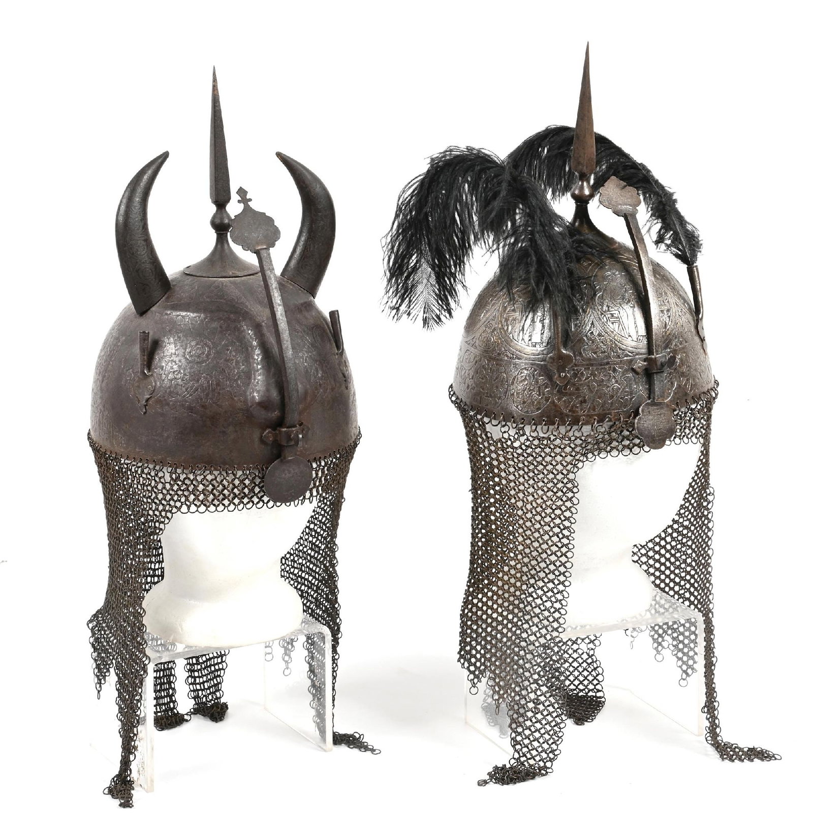 LOT OF 2: PERSIAN HELMETS.: Lot consists of two Kulah Khud helmets, one of the Devil Face type, the other with a more traditional skull. (A) Devil Face vairant with a central cruciform spike, horns, and a sliding nasal. Offset