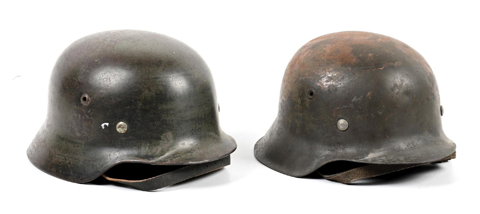 LOT OF 2: GERMAN WWII HEER M35 AND M42 HELMETS.: Lot contains: (A) Heer M35 with both decals removed, with less than half of the original smooth apple green paint remaining with heavy freckling. Rear inner skirt has the name "R.Sussmann" twice: