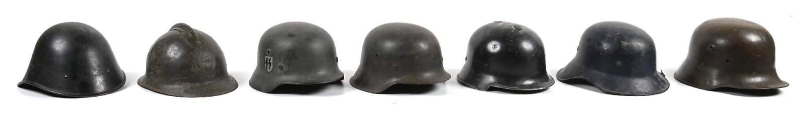 LOT OF 7: MISCELLANEOUS HELMETS.: Lot of 7 miscellaneous helmet include: (A) German WWII M40 helmet with reproduction SS decal, exterior retaining most of its rough gray-green paint, interior retaining most of it smooth gray-green