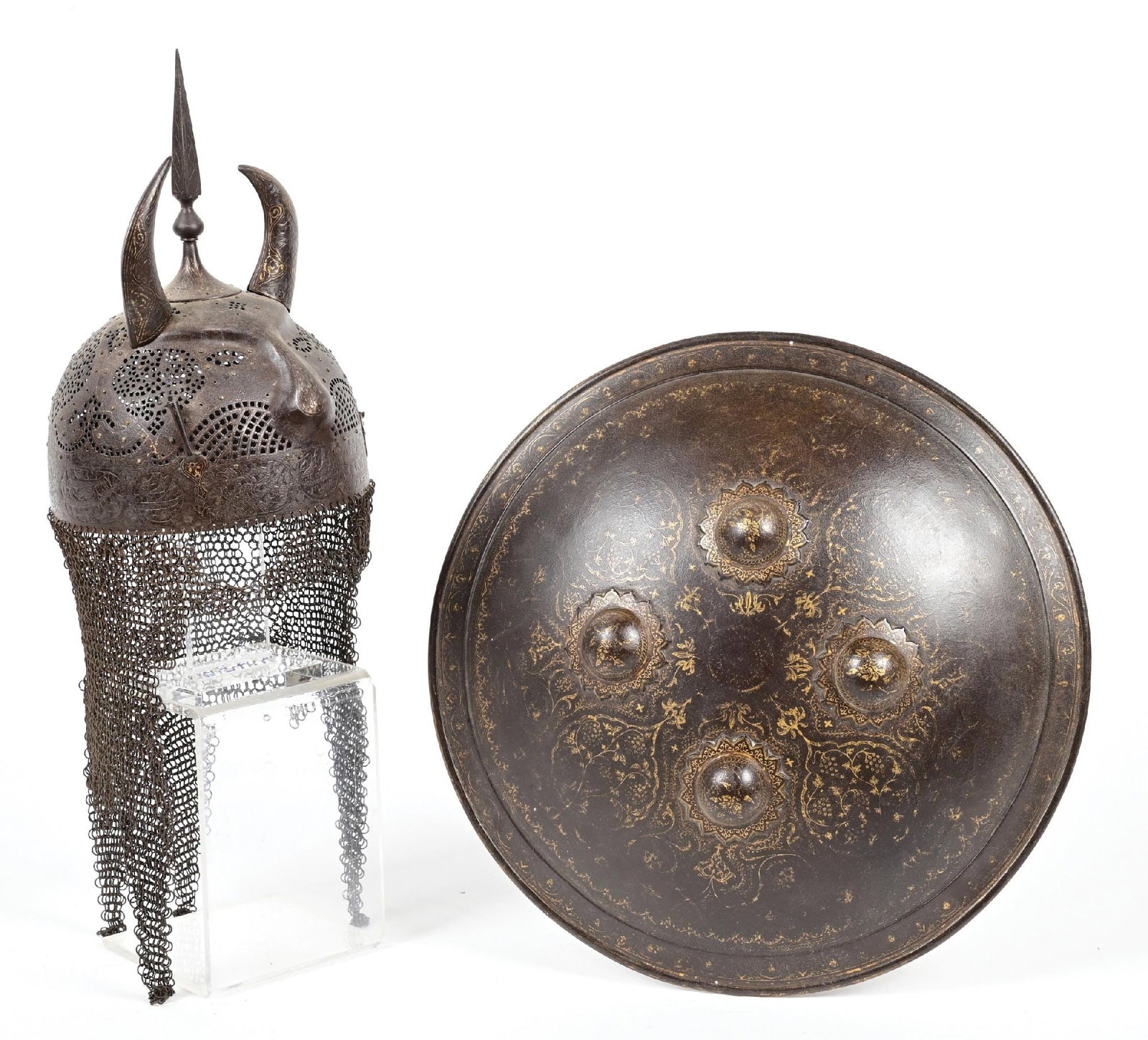 LOT OF 2: INDIAN OR PERSIAN HELMET AND SHIELD.: Lot consists of (A) Dhal or Sipar, of the shared Indian and Persian form with four bosses with floral bases, and gold koftgari work with in the form of florals and Islamic inspired elements. Interior