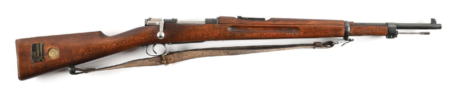 (C) SWEDISH HUSQVARNA M38 MAUSER BOLT ACTION RIFLE.: Manufactured in 1941. Classically configured with blued finish, drift adjustable blade front sight, ladder rear, and finger groove beech stocks. Externally visible numbers are matching excluding the f