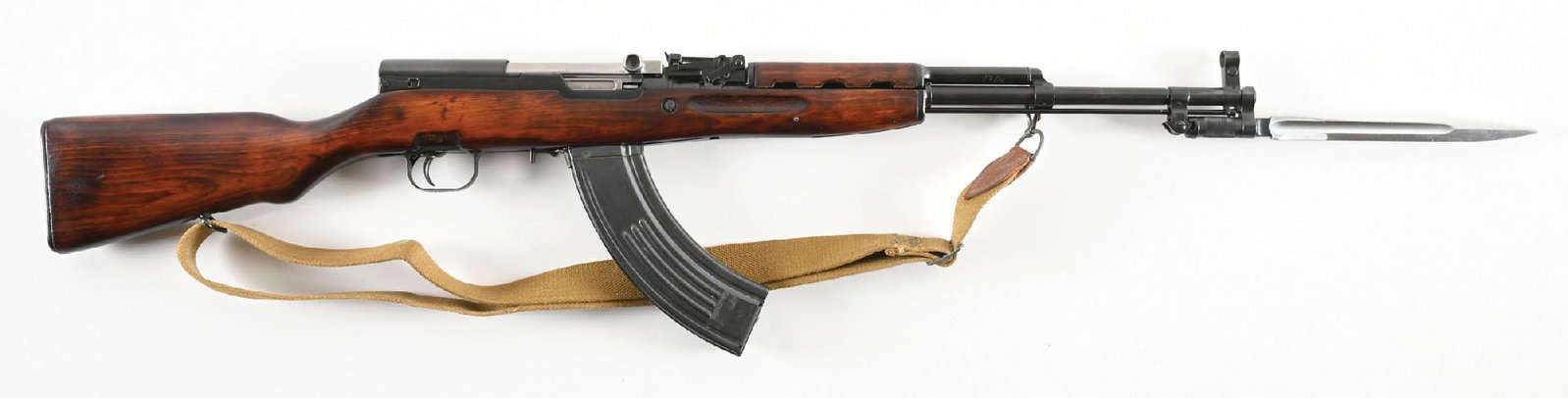 (C) RUSSIAN TULA SKS SEMI-AUTOMATIC RIFLE.: Manufactured in 1952. Arsenal blued finish, the bolt in-the-white. Hooded post front sight and tangent rear. Standard arctic birch stocks. The fixed magazine has been replaced with a removable afterma