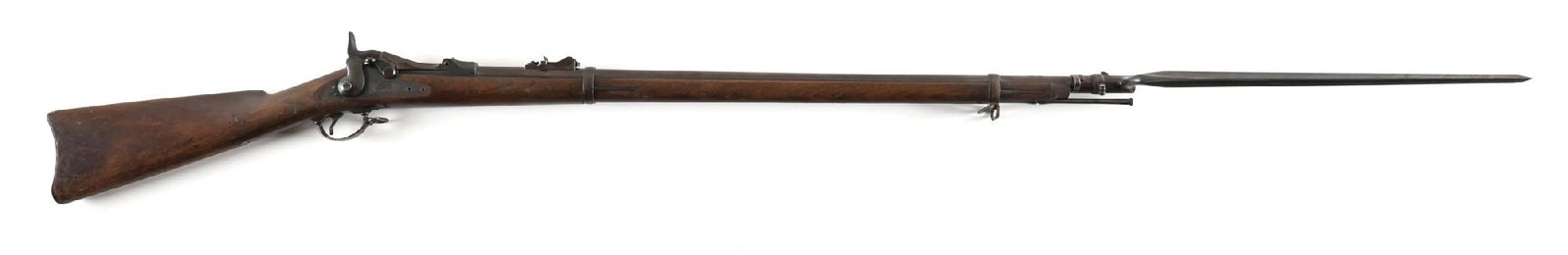 (A) US SPRINGFIELD MODEL 1879 TRAPDOOR RIFLE WITH BAYONET.: Blued barrel with pinned front sight and "R" marked 1879 rear sight. Breech block is marked "US / MODEL / 1873". Walnut stock with a clean "SWP / 1884" inspection cartouche. Includes "US" marked socke