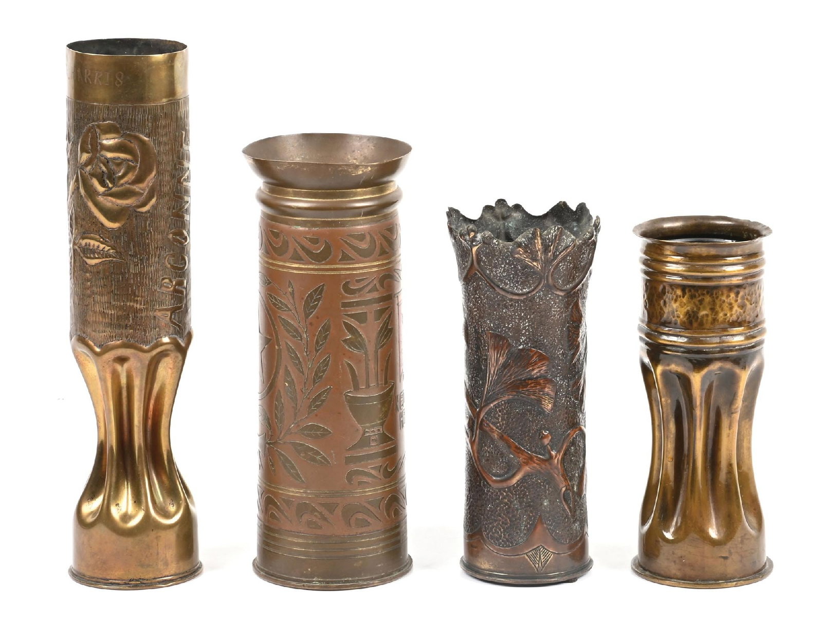 LOT OF 4: WWI AND WWII TRENCH ART SHELLS.: Lot consists of four trench art shells from the World War I-World War II era. (A) Tallest, measures 13 - 1/2" tall with floral art and marked "ARGONNE". Top rim is engraved "MRS. ELIZEABETH HARRIS".
