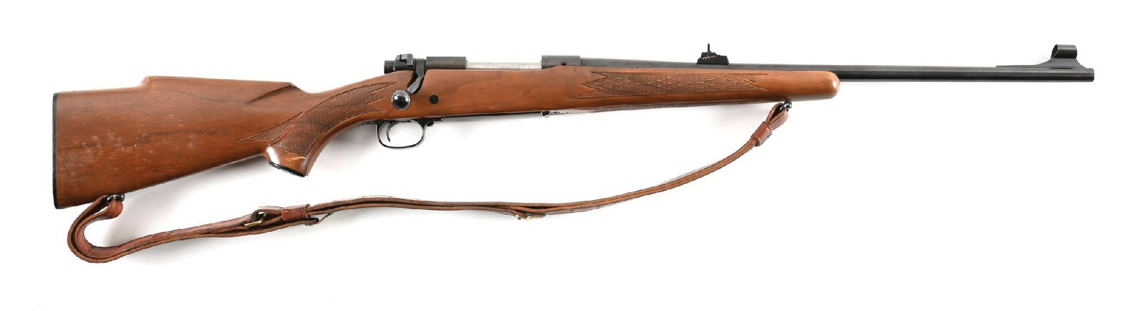 (C) WINCHESTER MODEL 70 BOLT ACTION RIFLE IN .308 WINCHESTER.: Circa 1969. Bead front sight on screwed-on island with matted ramp and slotted for hood. Sliding rear sight on boss. Typical Model 70 legends on left side of barrel and receiver. Press checkered stock