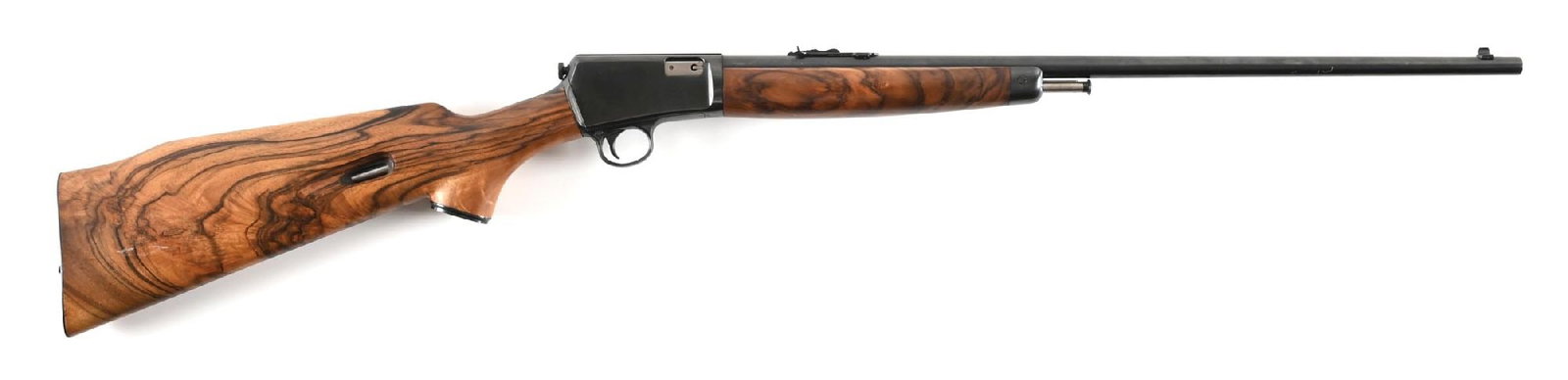 (C) CUSTOM WINCHESTER MODEL 63 SEMI-AUTOMATIC RIFLE.: Dates to 1957. This rifle features a highly grained set of custom stocks. The butt stock features a smooth pistol grip with a cap and checkered steel butt plate. The forearm matches. Standard features