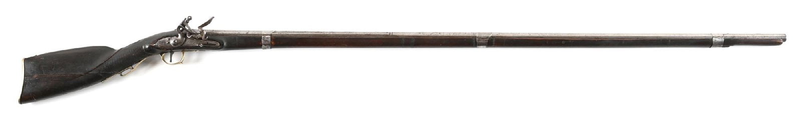 (A) FLINTLOCK TRADE FOWLER.: Features include long fowler style barrel with full stock, tin barrel bands, flint lock, brass trigger guard, brass lock retaining plate, and brass buttplate. Marked near breech with a Belgian style p