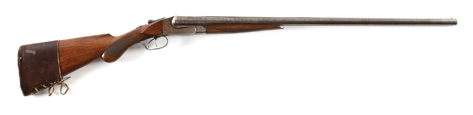 (A) ITHACA MODEL 1 DAMASCUS SIDE BY SIDE SHOTGUN.: Dates to 1904. Features Damascus barrels that have been shortened 1" with matted rib, single front bead, extractors, boxlock action, dual triggers, checkered walnut stock with round knob pistol grip, 