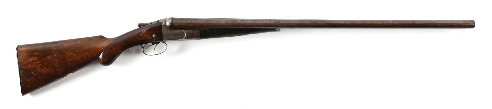 (A) W.W. GREENER TREBLE WEDGE FAST SIDE BY SIDE 10 BORE SHOTGUN.: Circa 1880s. The Damascus barrels are signed "W.W. GREENER 68 HAYMARKET LONDON. WINNER AT THE LONDON GUN TRIALS, 1875, 1877, 1878 & 1879." on the concave rib. Bead is missing. Treble wedge lockup to t