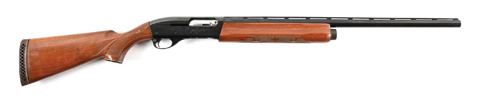 (M) REMINGTON MODEL 1100 12 GAUGE SEMI-AUTOMATIC SHOTGUN.: Classic configuration with a matted vent rib, large format bead front sight, press checkered walnut stocks, and waffle recoil pad. Fit for Tru-Choke, Full installed, and further accompanied by Super F
