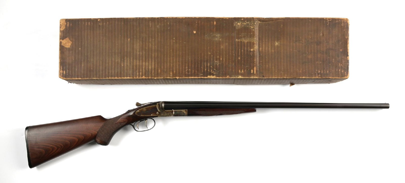(C) OUTSTANDING L.C. SMITH FWE SIDE BY SIDE 20 GAUGE SHOTGUN IN ORIGINAL PERIOD BOX.: Dates to 1913. All numbers are matching. The water table has the FWE stamp indicating this is a Featherweight equipped with rare ejectors. Every other feature is standard to include the sidelock