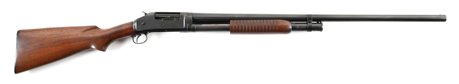 (C) WINCHESTER MODEL 97 SLIDE ACTION SHOTGUN.: Dates to 1949. This is a standard late takedown gun with blue finish, single bead front sight, plain walnut stock with pistol grip, black Winchester buttplate, and matching flat bottom serrated