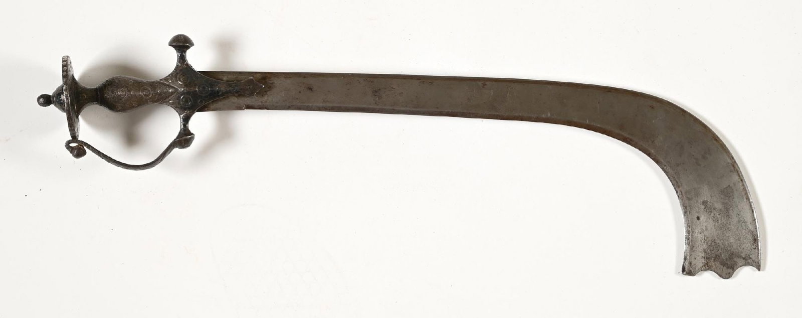 KORA SWORD.: The Kora is traditionally associated with India, Nepal, and Tibet; this example, with its tulwar hilt, is of Indian taste. Blade measures approximately 19" on the diagonal from tip of blade, flaring t