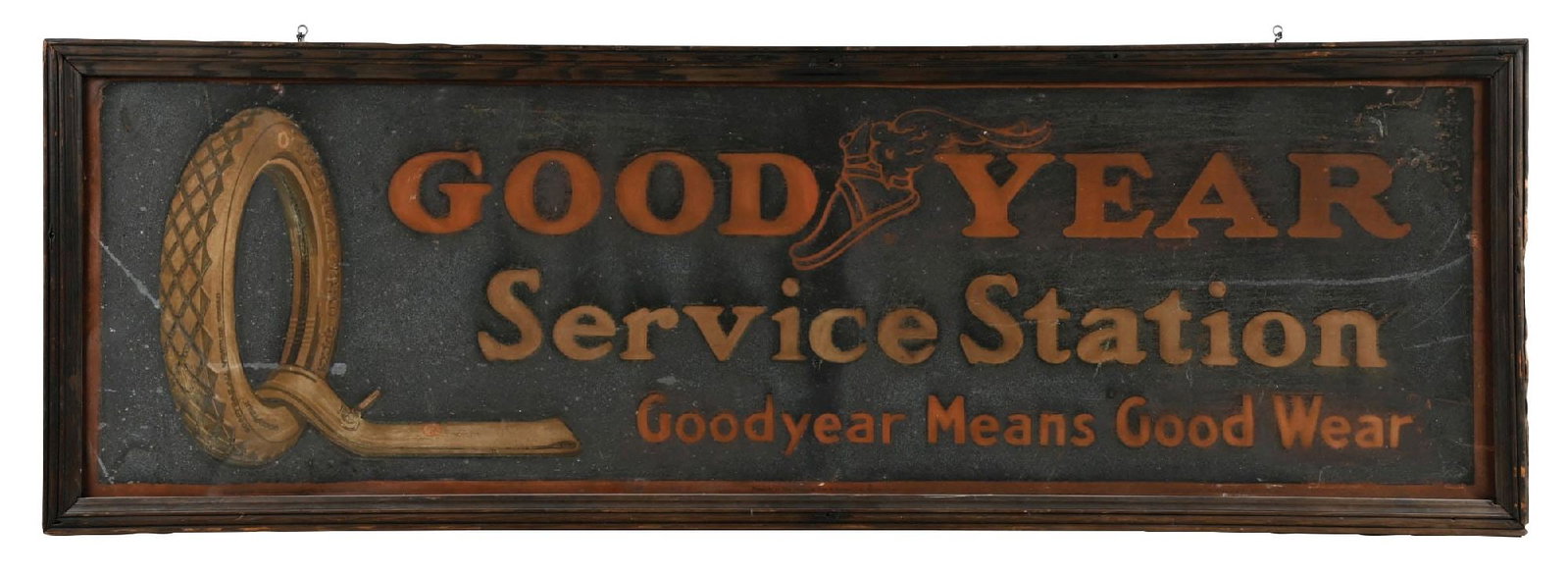 GOODYEAR SERVICE STATION SAND PAINTED TIN SIGN W/ ORIGINAL WOOD FRAME: SST. C. 1920s. CONDITION: Showing fair color throughout with minor areas of surface scratching and general age wear in the inner and outer fields, giving the piece an excellent original patina. Wooden