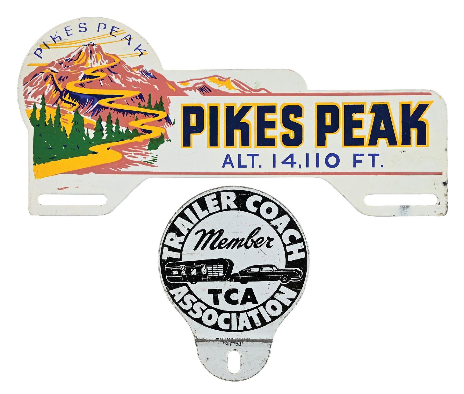 COLLECTION OF 2: PIKES PEAK AND TRAILER COACH ASSOCIATION TIN LICENSE PLATE TOPPERS: Collection Consists Of: Pikes Peak Tin License Plate Topper, Grade 8.75. Trailer Coach Association Tin License Plate Topper, Grade 7.75. Condition: (Various). Dimensions: Largest: 9 - 7/8" x 4 - 5/8".