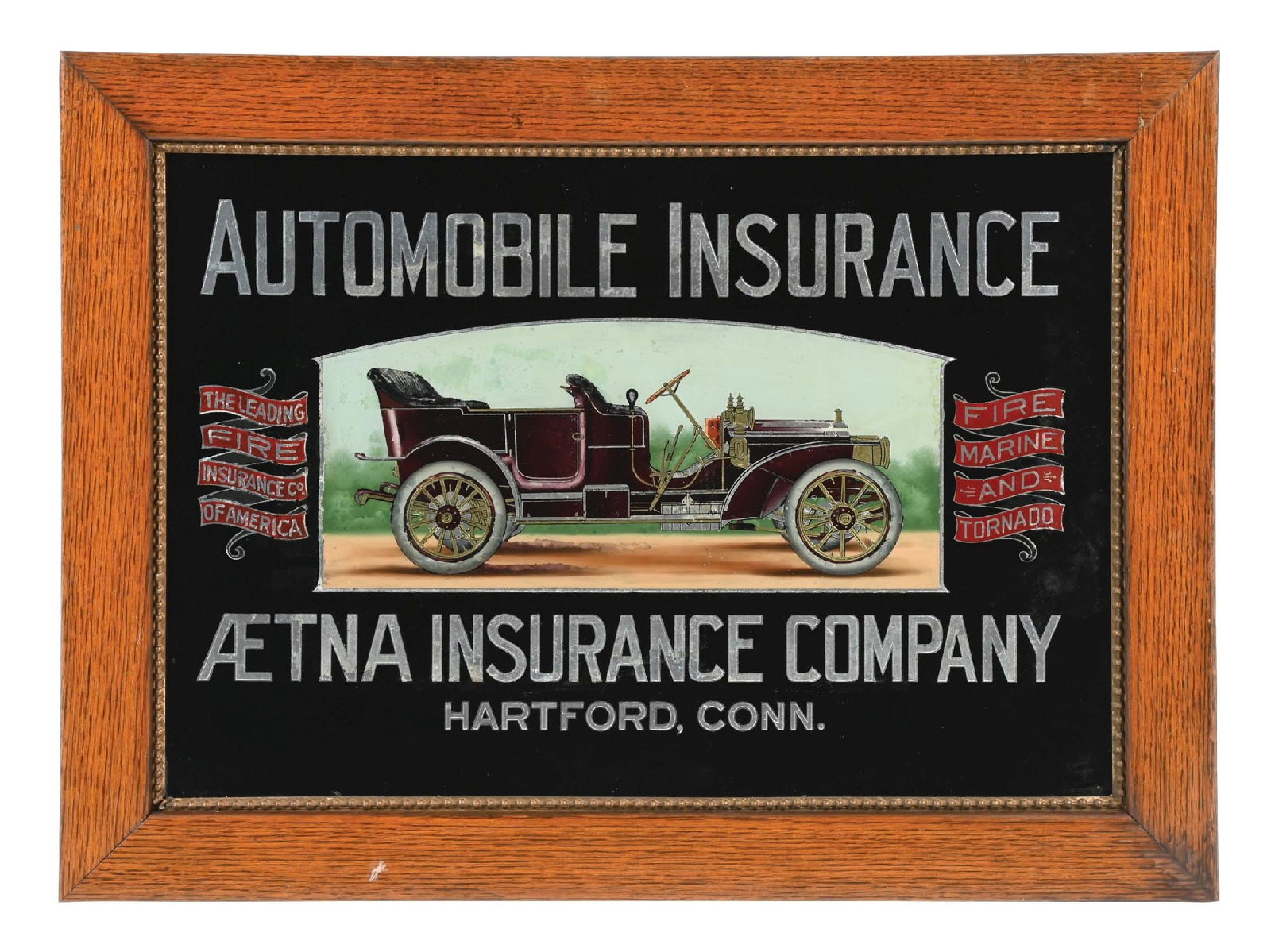 OUTSTANDING AETNA INSURANCE COMPANY REVERSE PAINTED GLASS SIGN W/ EARLY AUTOMOBILE GRAPHIC (1 of 2)