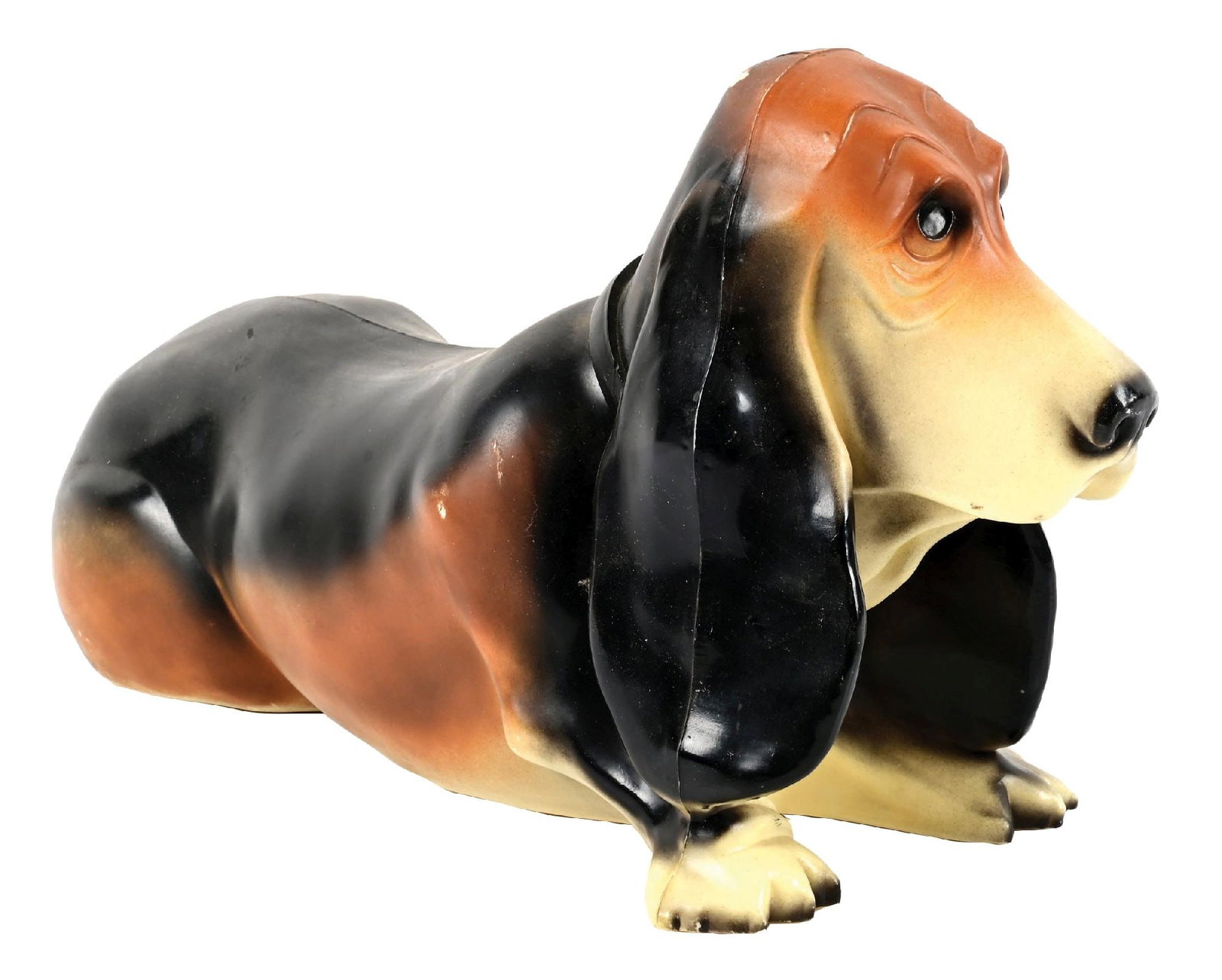 FLYING A GASOLINE BASSET HOUND ADVERTISING COIN BANK: C. 1950s. CONDITION: Overall very good, showing light general age and use wear. Body showing great original paint with light chips. Flying A graphic in excellent condition. Missing coin cap at the bot