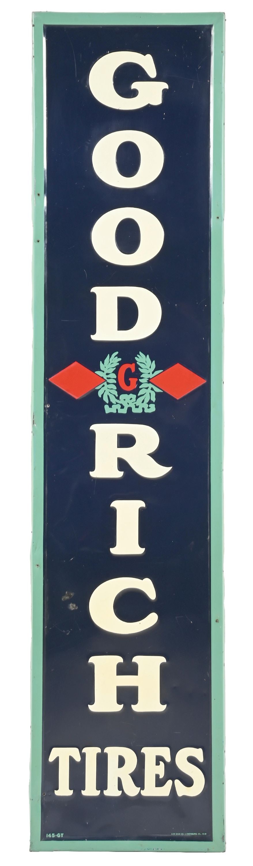 GOODRICH TIRES EMBOSSED TIN SIGN WITH ORIGINAL WOOD BACKING: SST. Sign is Maker Marked A.M. and Dated 1939. CONDITION: Very good color and gloss throughout showing minor areas of light surface scratches as well as some shallow dents. Added nail holes along the 