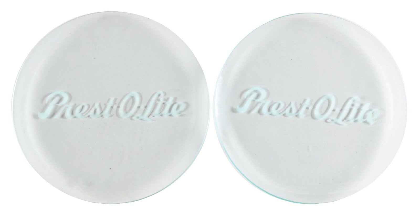 COLLECTION OF 2: PREST-O-LITE BATTERIES 13.25" GLOBE LENSES: Pair of glass lenses showing "Prest-O-Lite" etched into the field of each. CONDITION: Lenses are each in excellent condition, showing no notable wear other than some light storage wear. It is unclear