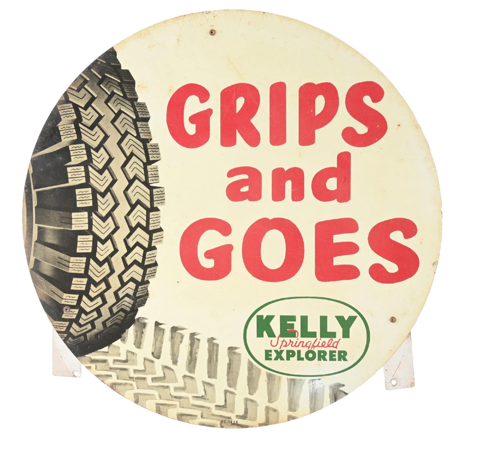 KELLY SPRINGFIELD EXPLORER "GRIPS AND GOES" TIN TIRE INSERT SIGN: SST. CONDITION: Very good color, showing areas of light staining as well as some minimal surface scratches. Light wear along the outer edges with inserts attached. Condition: (8.0). Dimensions: 15 -