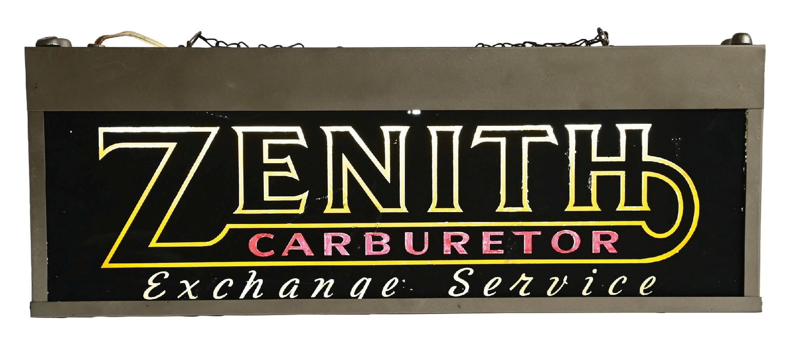 ZENITH CARBURETOR EXCHANGE SERVICE GLASS LIGHT UP SIGN: Double-Faced Glass Light-Up Sign showing Zenith Carburetor Exchange Service painted throughout each lens. CONDITION: Lens one overall very good, showing general wear with areas of touch-up. Lens two s