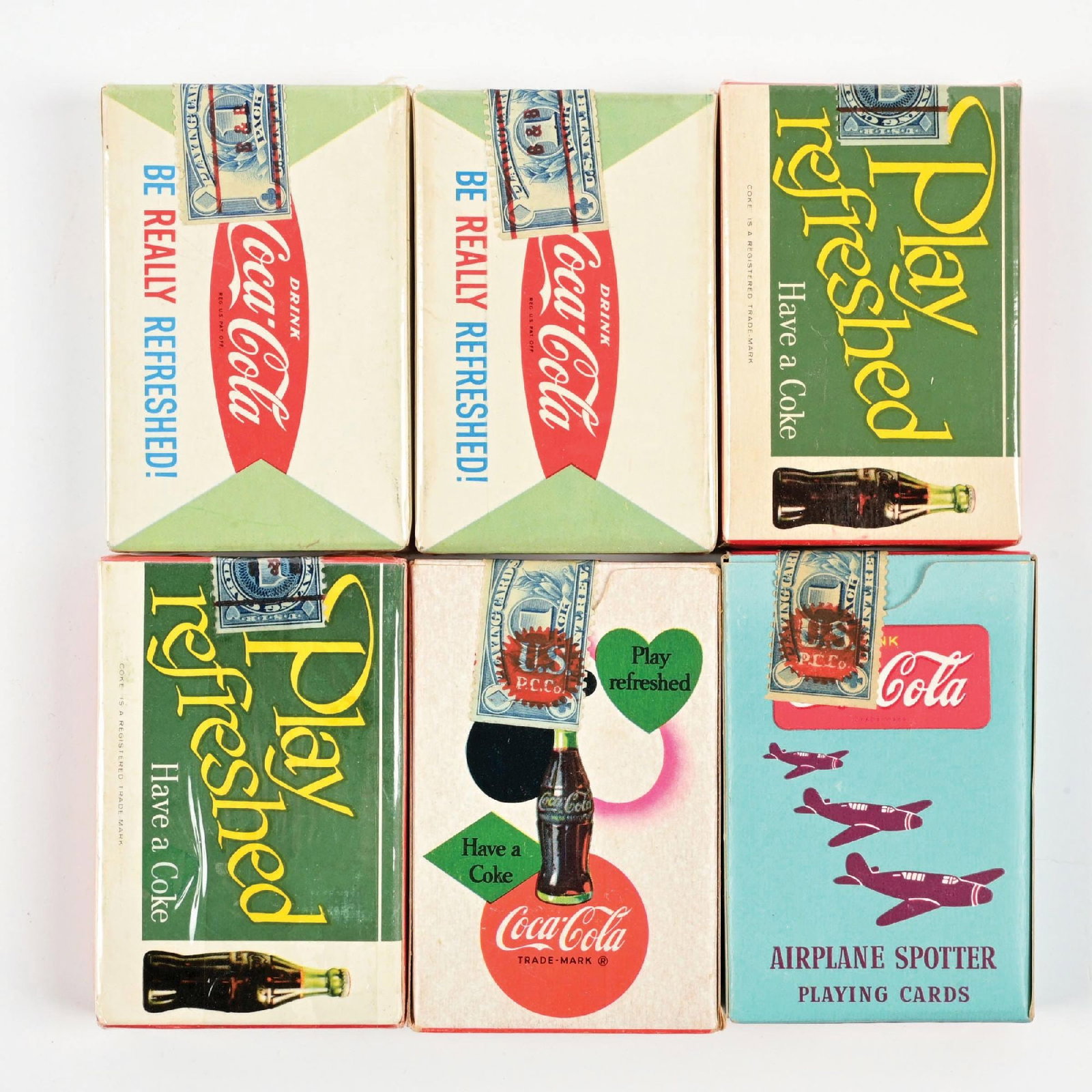 COLLECTION OF 6: DECKS OF COCA-COLA PLAYING CARDS: A nice collection of six decks of Coca-Cola playing cards from the 1950s-1960s with great graphics and color. CONDITION: The are all clean, with some never have been opened. Some show light storage