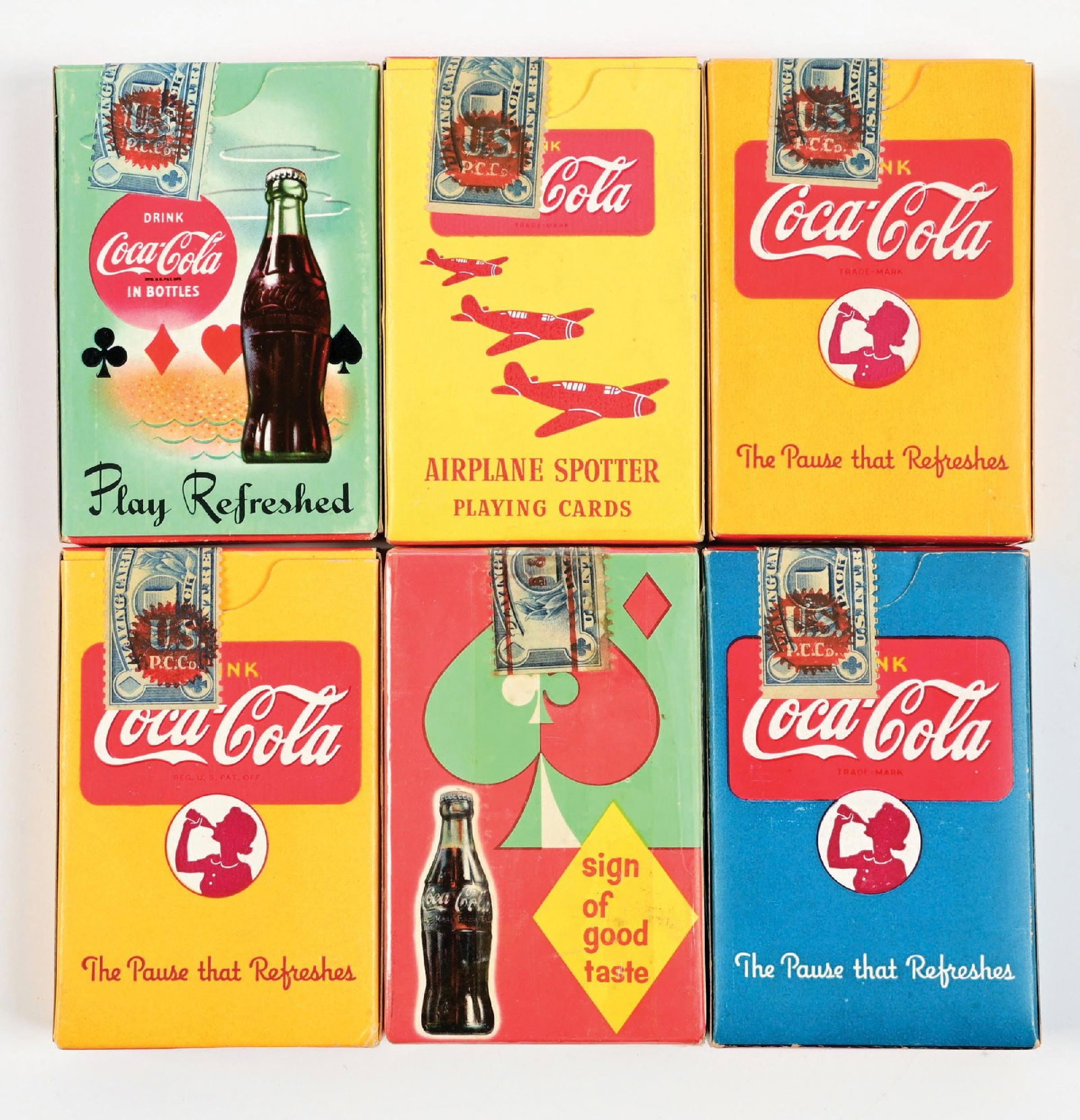 COLLECTION OF 6: COCA-COLA PLAYING CARDS: A nice collection of six decks of Coca-Cola playing cards from the 1940's-1960's with great graphics and color. CONDITION: The are all clean, with some never have been opened. Some show light storage
