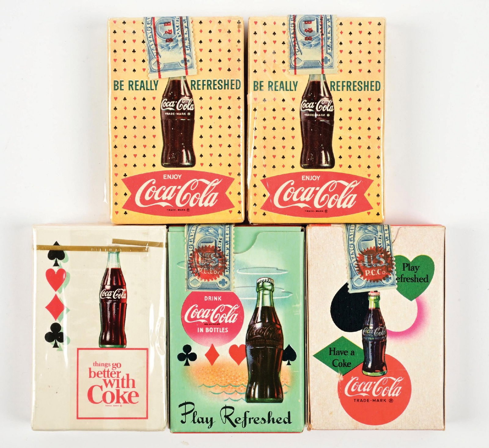 COLLECTION OF 5: COCA-COLA PLAYING CARDS: A nice collection of five decks of Coca-Cola playing cards from the 1950's-1960's with great graphics and color. CONDITION: The are all clean, with some never have been opened. Some show light