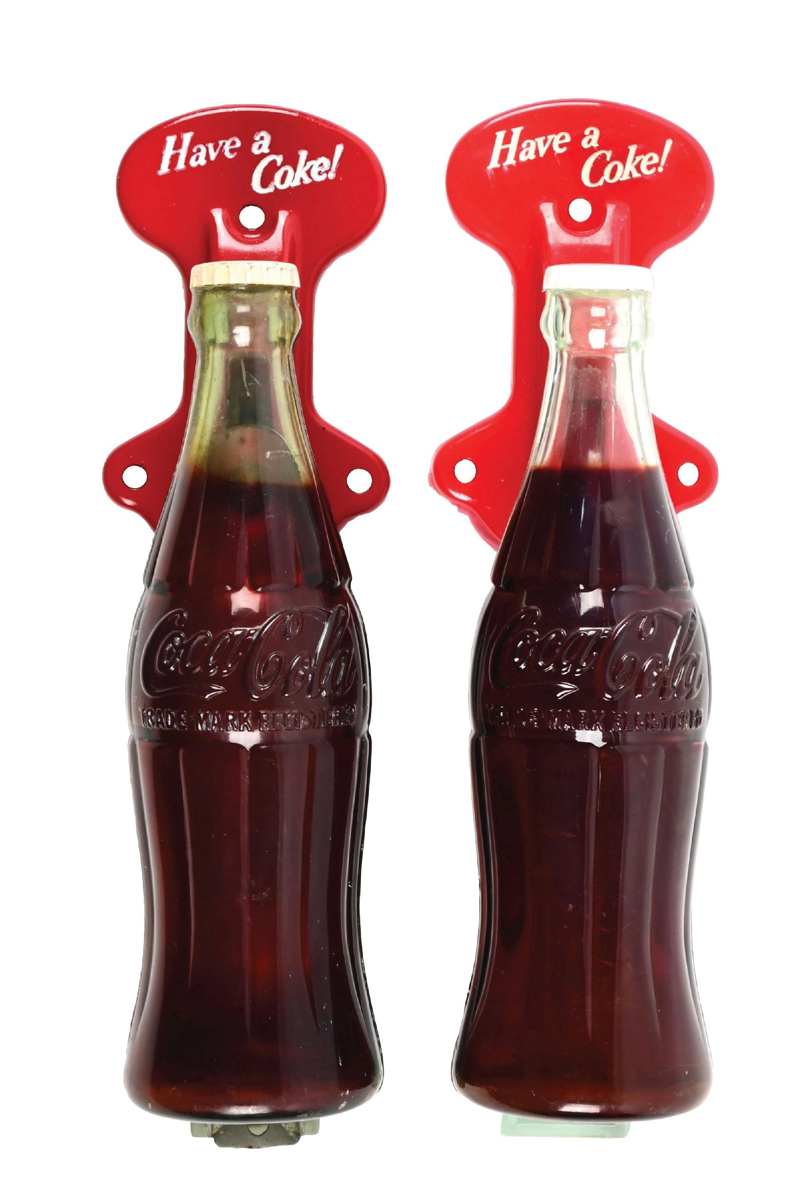 COLLECTION OF 2: COCA-COLA BOTTLES DOOR PULLS: A nice collection of two c. 1950s plastic and metal door pull handles featuring the iconic contour Coca-Cola bottle as the handle. CONDITION: Both remain clean and undamaged. One has the metal