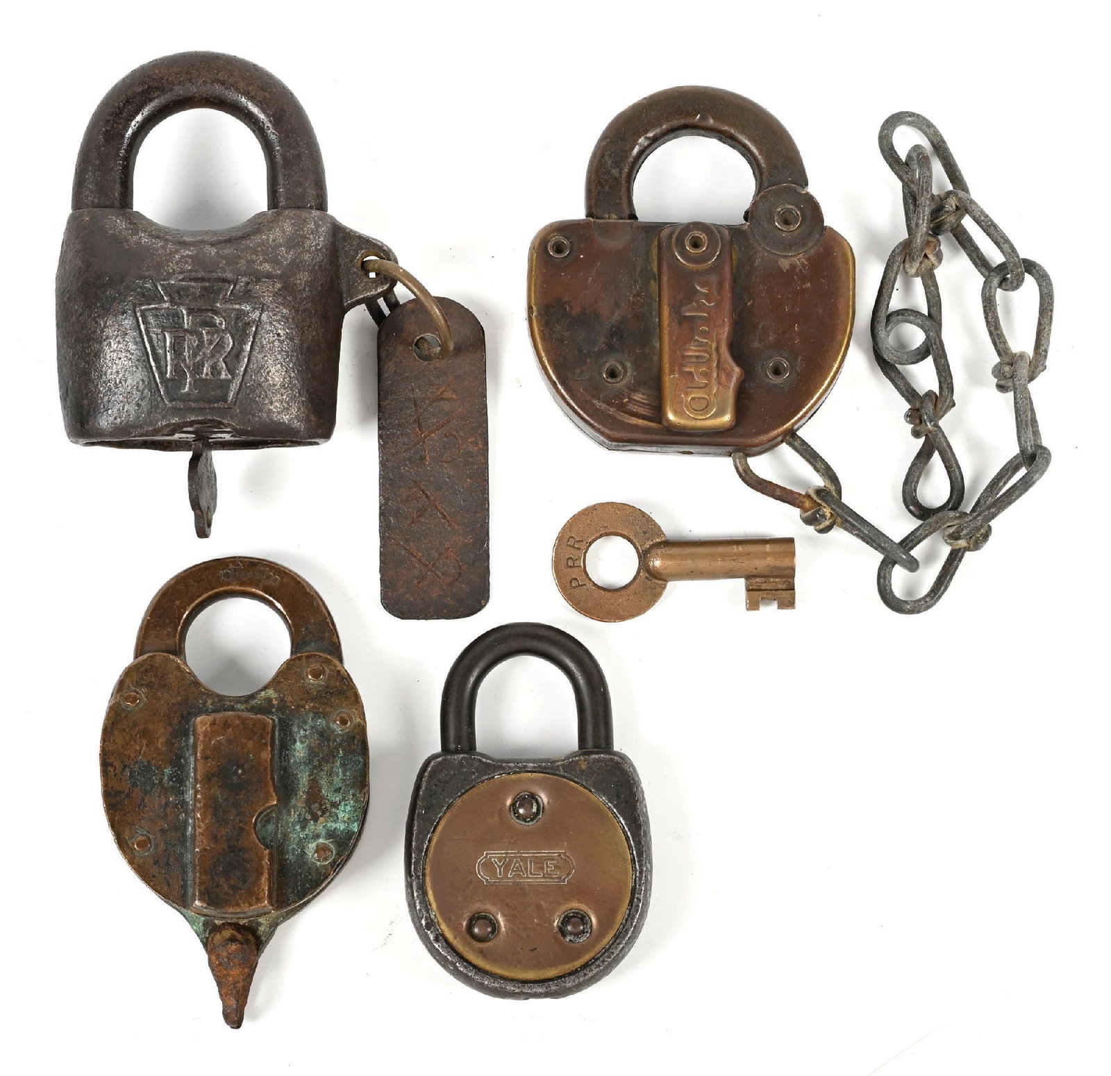 LOT OF 4: RAILROAD LOCKS: (A) A cast iron Scandinavian potato lock with the PRR Keystone logo nicely embossed on the face. There is a wired steel tag affixed that is incised “135C”. The back of the lock is incised