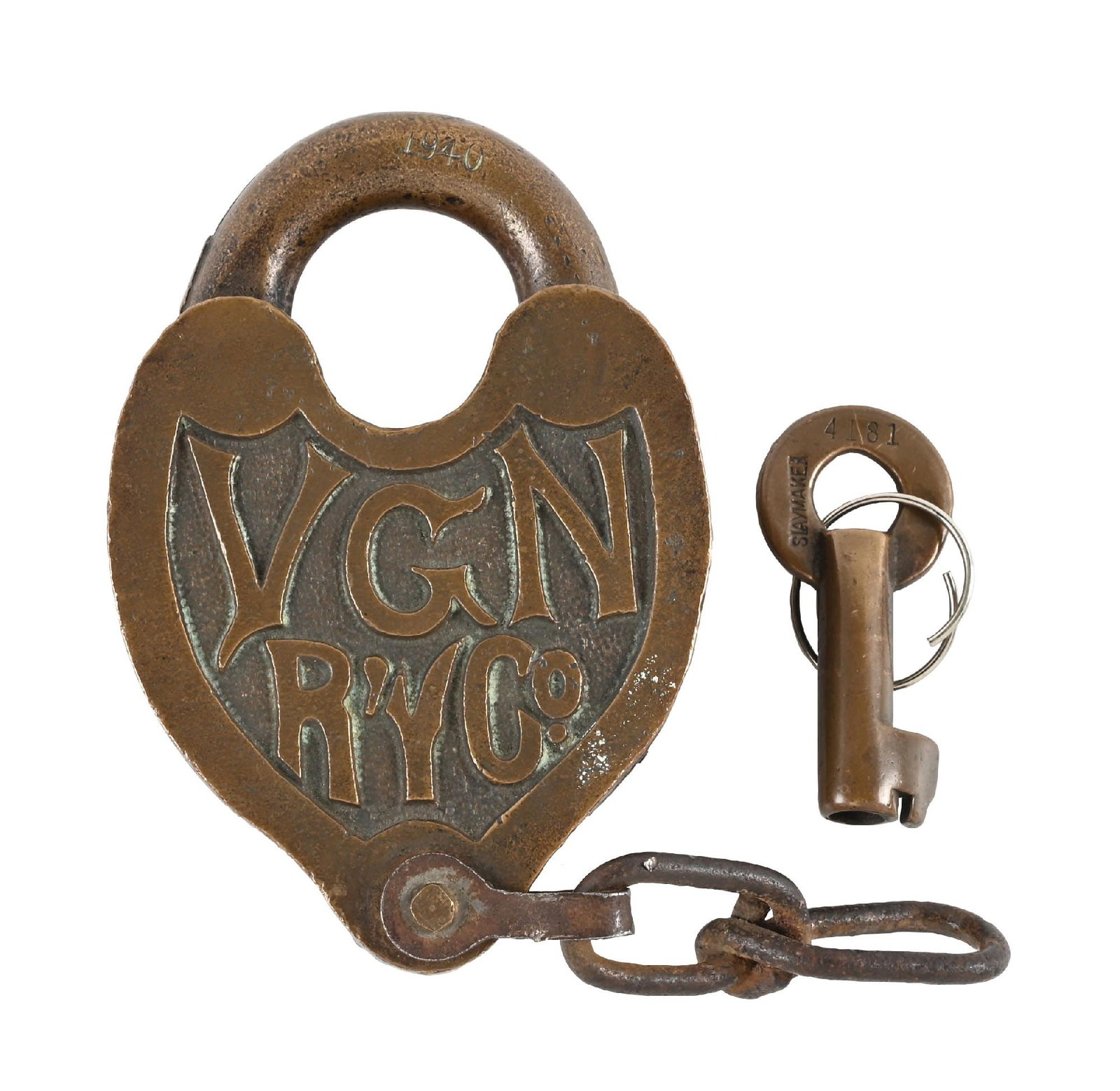 RAILROAD LOCK: A brass heart-shaped switch lock, nicely embossed “VGN R’Y Co.” on a lightly-pebbled background. The round, bronze shackle is incised “1940”. The dust cover spring is fun