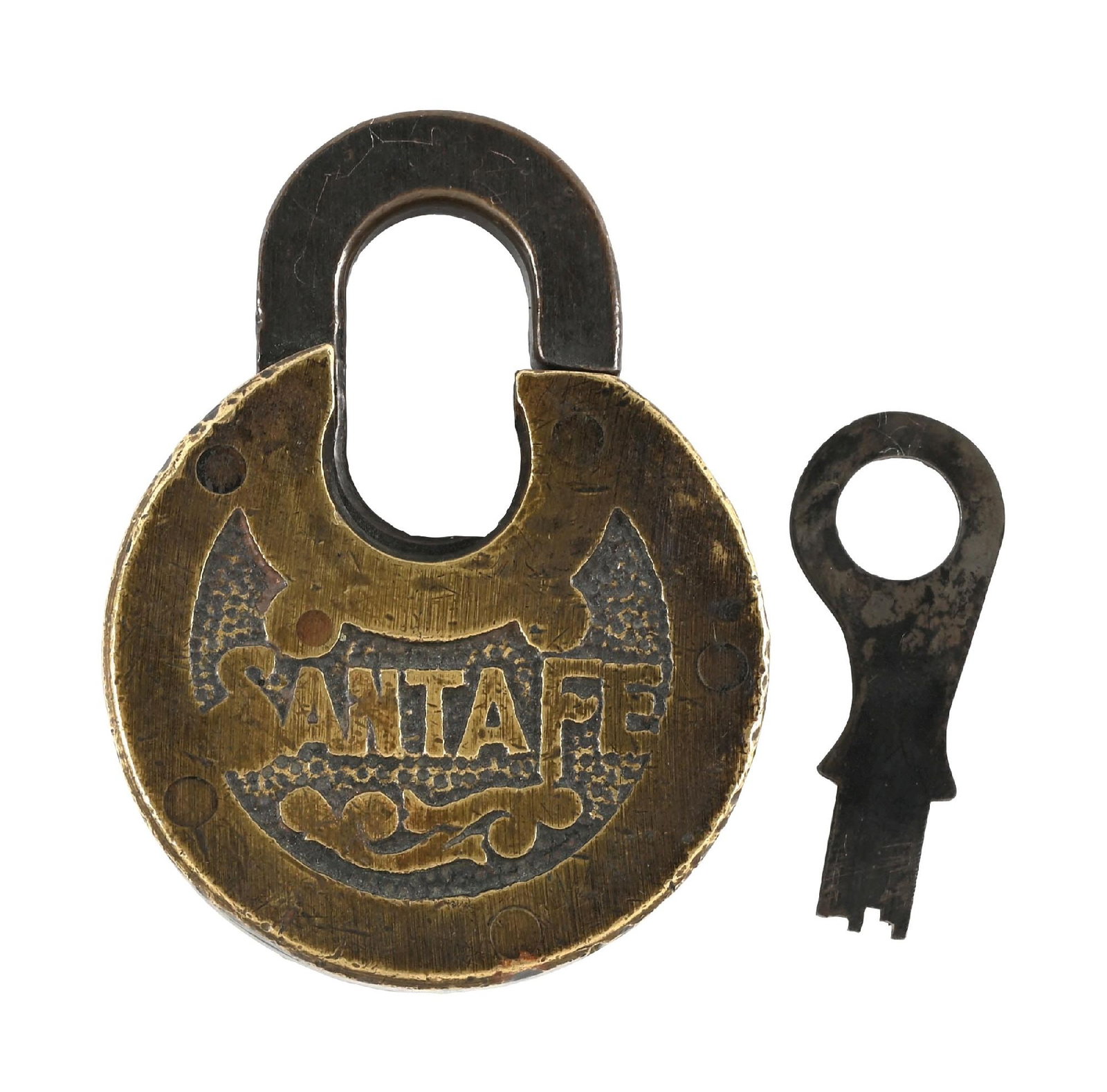 RAILROAD LOCK: A bronze pancake lock, nicely embossed “SANTA FE” on a pebbled background with decoration. The extended shackle is incised “MADE IN USA”. There is a flat steel push-key include