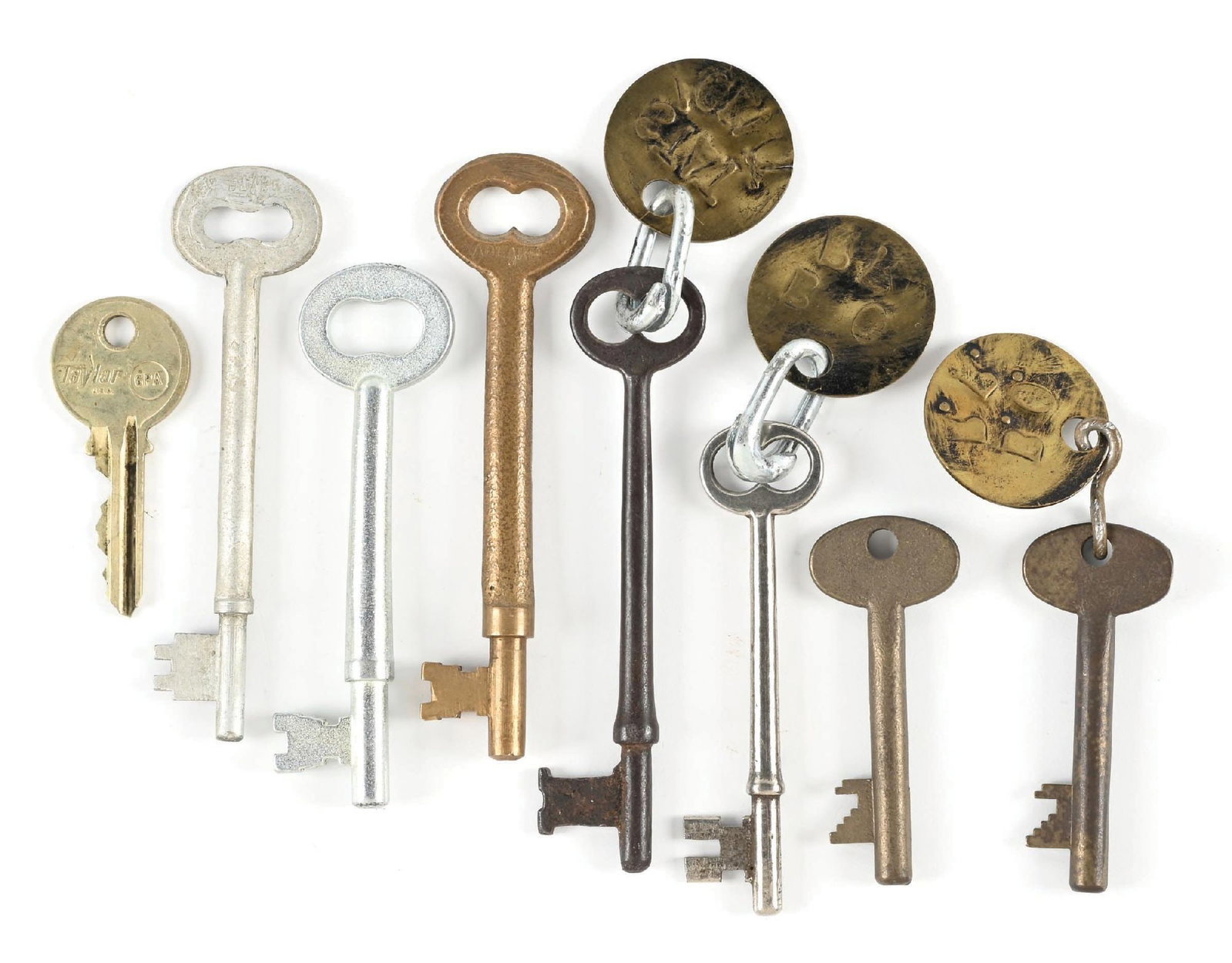 LOT OF 8: RAILROAD KEYS: (A) A bronze skeleton key with brass tag attached, incised “B.O.R.R.”. (B) A bronze Adlake long shank skeleton key. (C) A plated steel long shank skeleton key, incised “J. L. H.