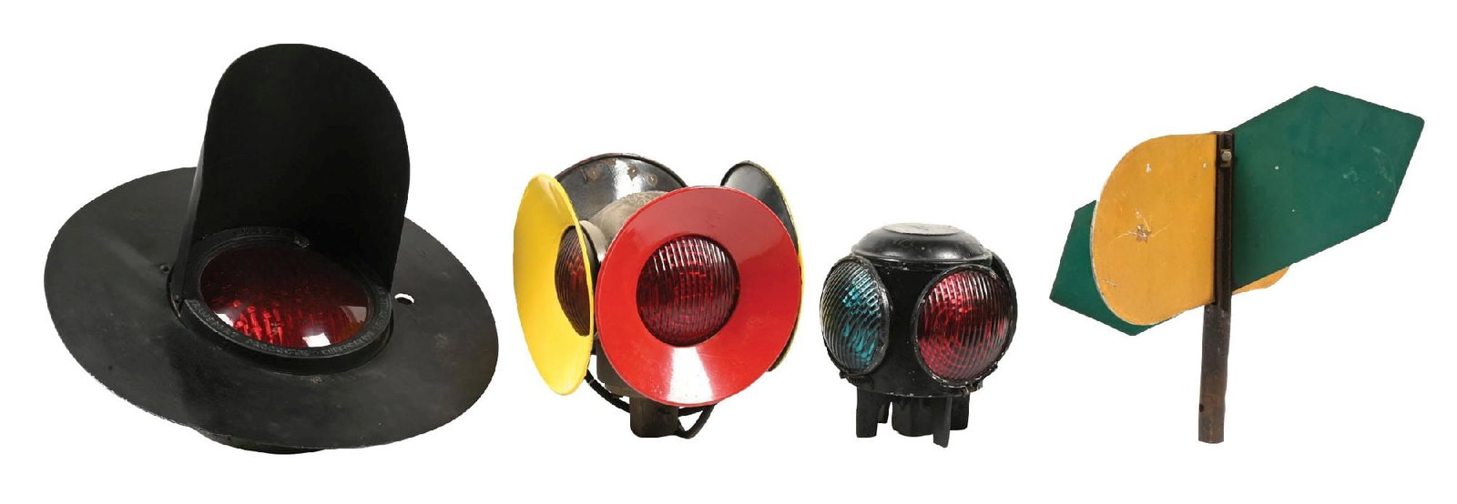 ELECTRIC RAILROAD LIGHTS: (A) A hooded signal light with an 8” diameter red lens, no electrical components evident in the housing. Unit was made by the Transport Products Corporation, Louisville, Kentucky, Model F. The u