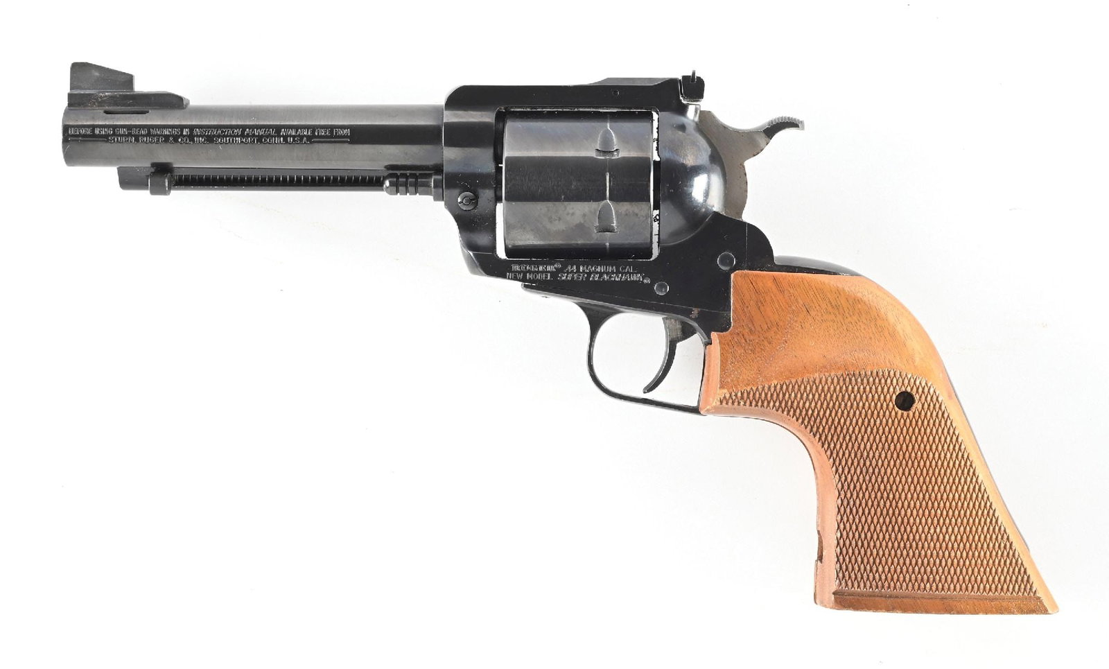 (M) CUSTOM RUGER NEW MODEL SUPER BLACKHAWK .44 MAGNUM REVOLVER.: Dates to 1982. The barrel on this gun was shortened to 5", ported and front sight re-installed. Also fitted with a pair of Herrett Shooting Star checkered walnut grips. Finish is standard blue sportin