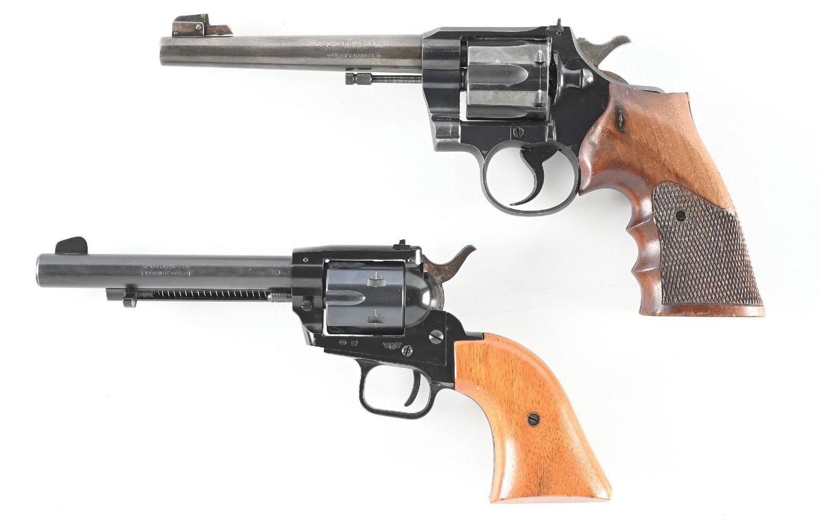 (C) LOT (2) REVOLVERS : COLT OFFICERS MODEL .38 SPECIAL DOUBLE ACTION REVOLVER AND A HERBERT SCHMIDT: A. Colt. Dates to 1949. Features the blue finish, adjustable front sight and rear sights, checkered trigger, hammer spur, serrated back strap and sporting custom checkered walnut grips. CONDITION: Ver