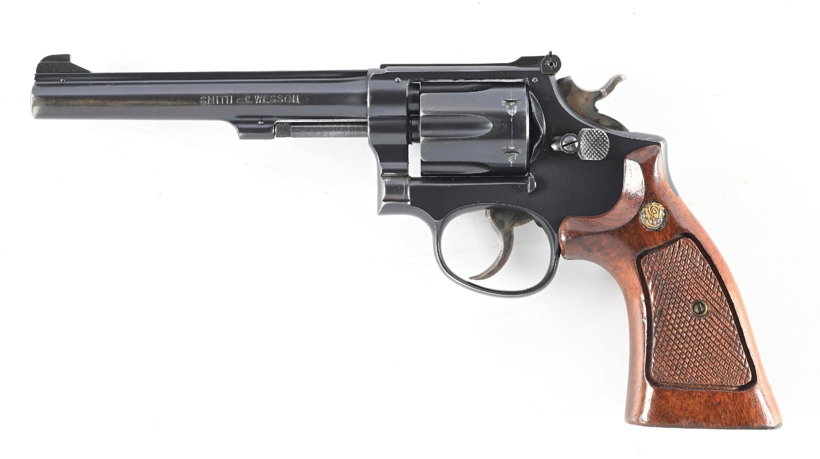 (C) EARLY POST WAR SMITH & WESSON K-22 MASTERPIECE DOUBLE ACTION REVOLVER.: Dates to 1948. Built on the square butt K-frame, 4 screw with pinned barrel and recessed chambers. Features the blue finish, full rib, adjustable rear sight, case color hammer and trigger. Matching nu