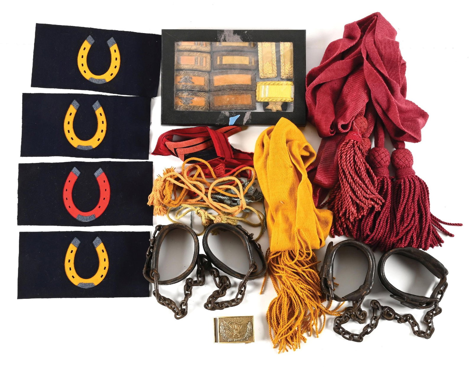 LOT OF CIVIL WAR-INDIAN WARS GEAR AND UNIFORM PIECES.: Lot consists of a mix of period and replica Civil War-Indian Wars uniform pieces and gear including two crimson officer's sashes, a yellow cavalry sash, five pairs of shoulder straps (several are