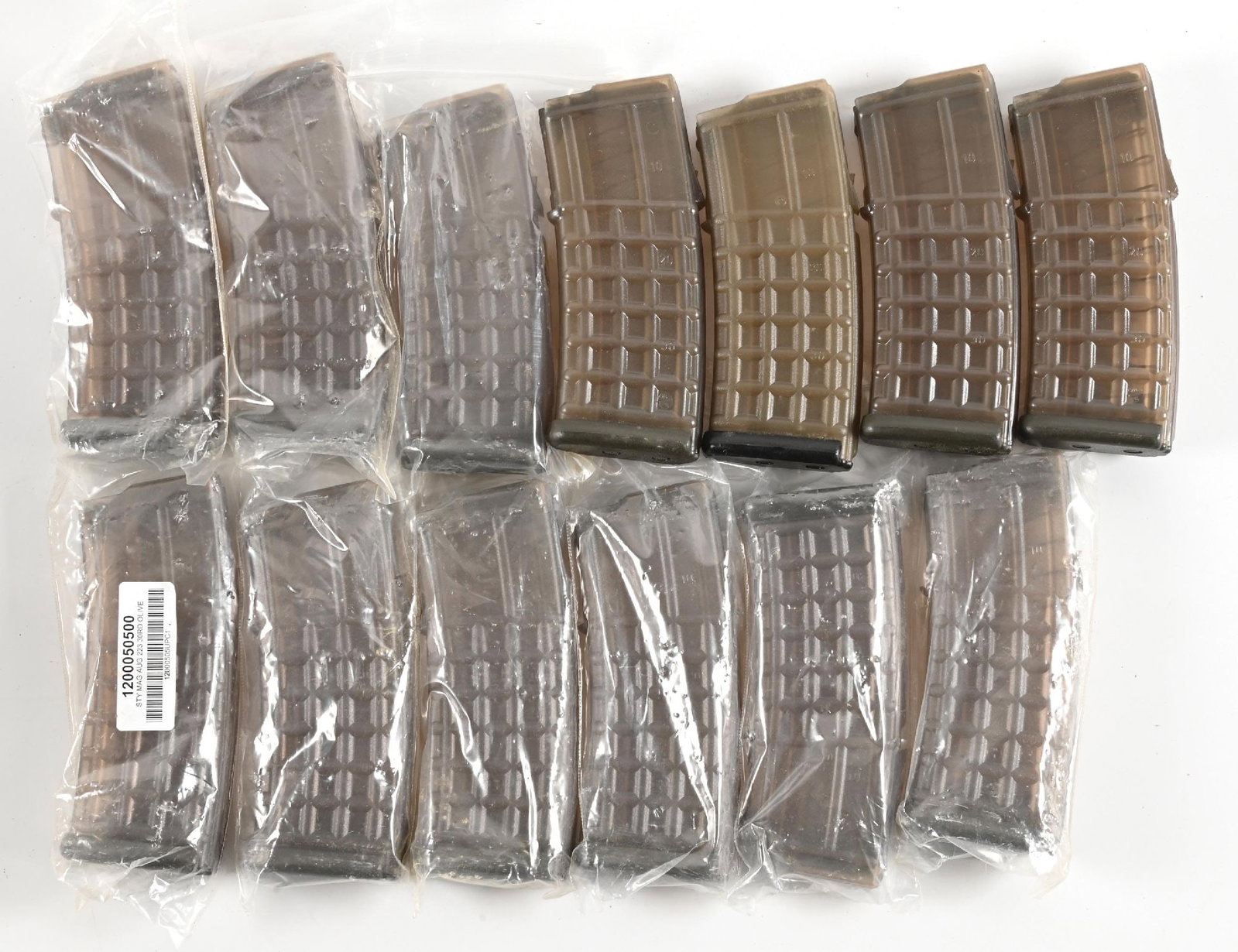LOT OF 13: STEYR AUG MAGAZINES.: Lot consists of 13 olive green transparent waffle pattern polymer 30-round magazines for the Steyr AUG. Most remain in their plastic bags as new. CONDITION: Excellent.