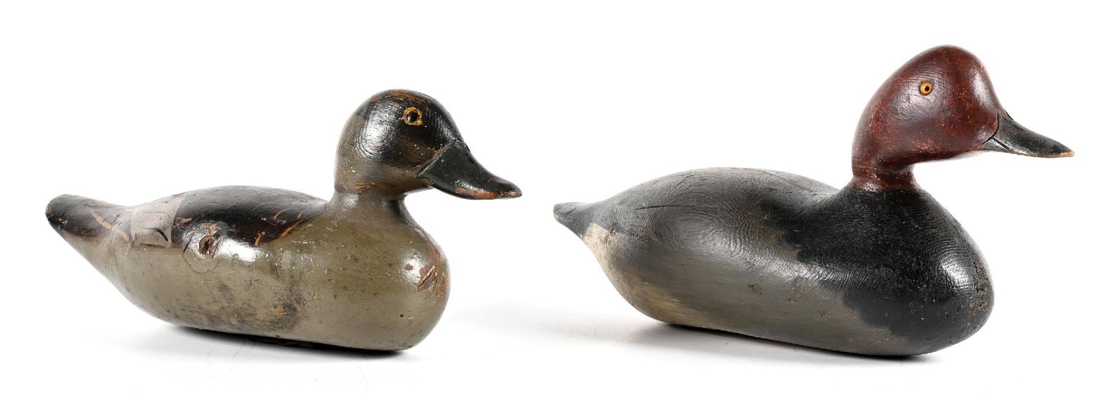 A PAIR OF VINTAGE WOODEN DUCK DECOYS: 1. EARLY 20TH CENTURY WORKING REDHEAD DRAKE DECOY. CONDITION: Solid-body redhead drake decoy with carved head and bill, retaining its original tack eyes and remnants of original redhead paint, includi