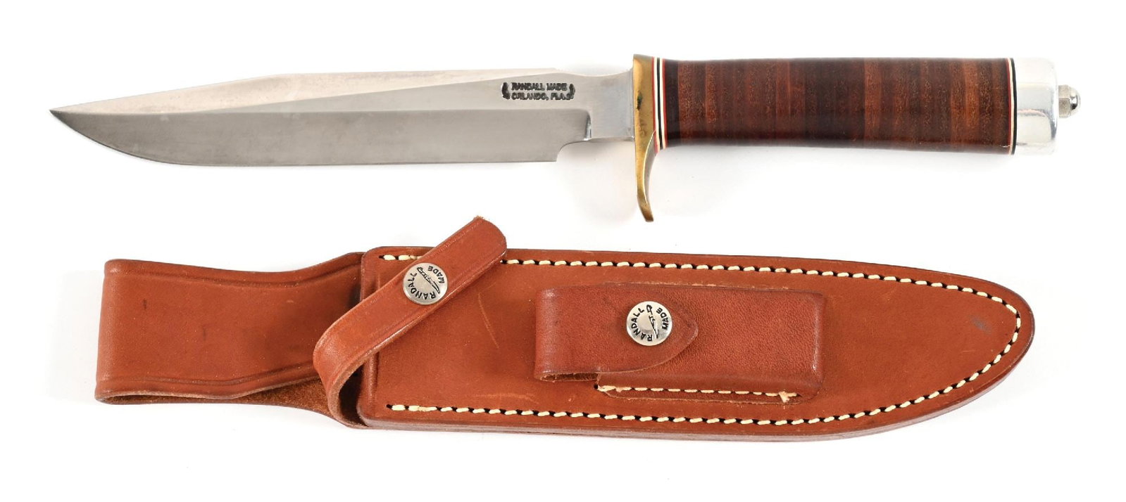 RANDALL MODEL 5-7 CAMP AND TRAIL KNIFE.: Randall Model 5-7 with clip point blade marked "RANDALL MADE / ORLANDO, FL" between Randall's signature scimitars. Carbon steel construction. Blade is bright with great cross graining. Light