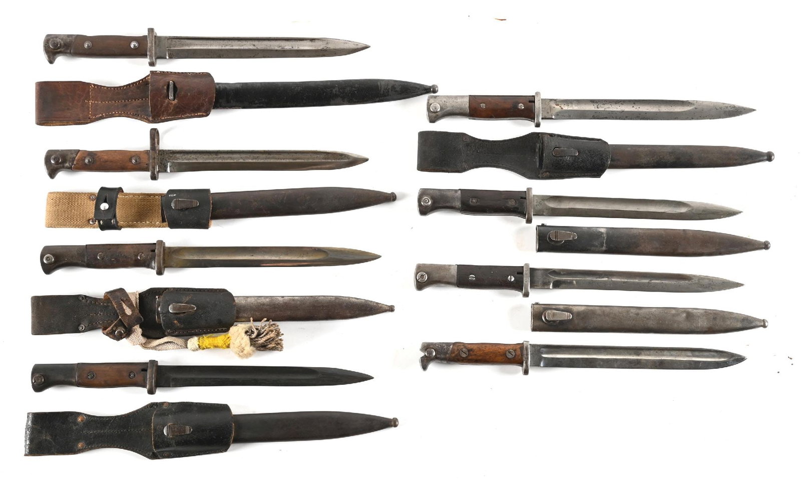LOT OF 8: MISCELLANEOUS MAUSER BAYONETS.: Lot consists of: (A) 71/84. Marked "WEYERSBERG / KIRSCHBAUM & CO / SOLINGEN" on ricasso. Spine marked "L88". Cross guard unit marked "B.16.R.2.208.". Complete with metal scabbard and leather frog