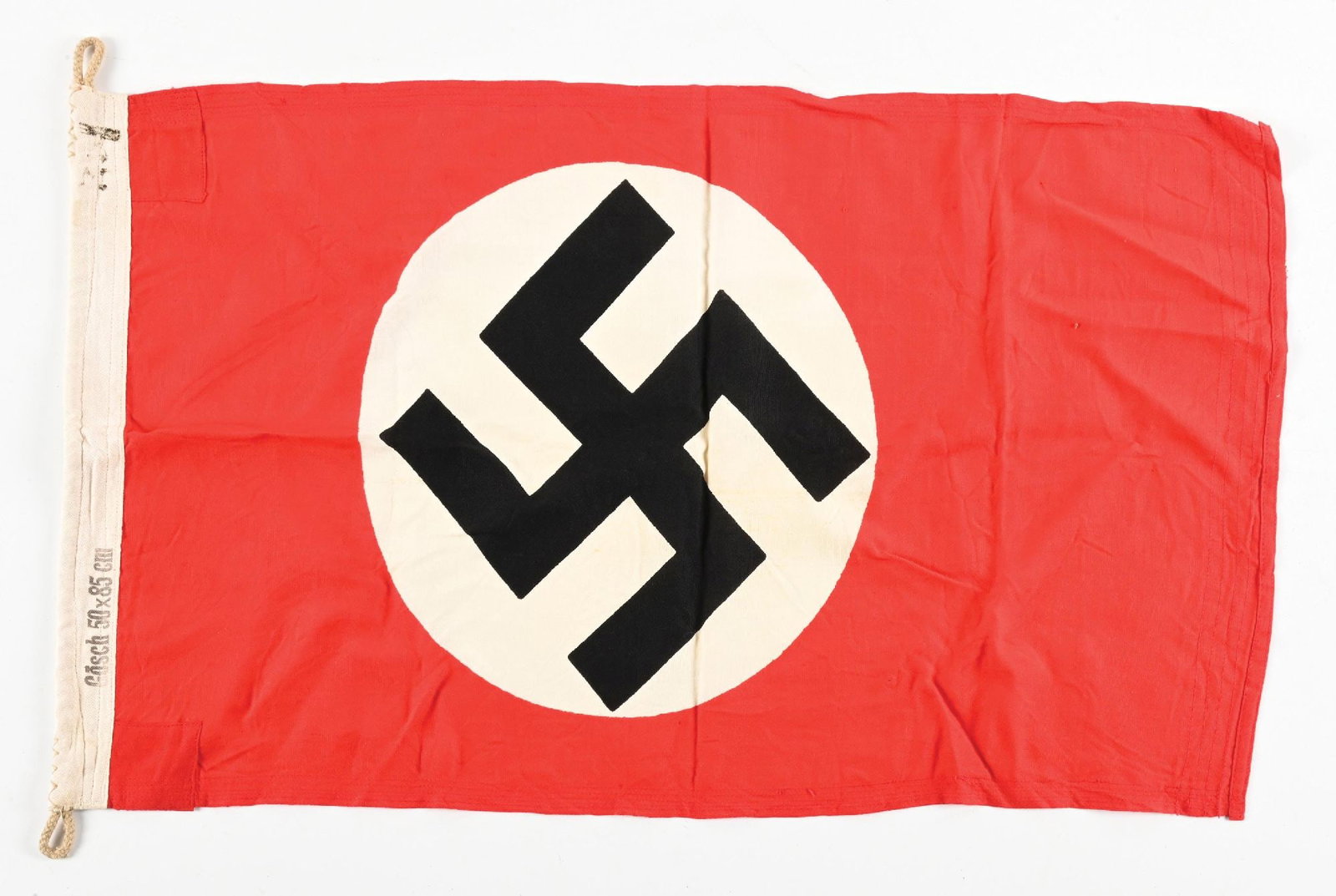 GERMAN WWII KRIEGSMARINE MARKED NSDAP FLAG.: Third Reich NSDAP doubled-sided Kriegsmarine flag marked "Goesch 50x85 cm", "Koechlin. Baumgartner u. Cie. AG. Loerrain...", with the "eagle over M". Flag has several tiny holes from what appears to