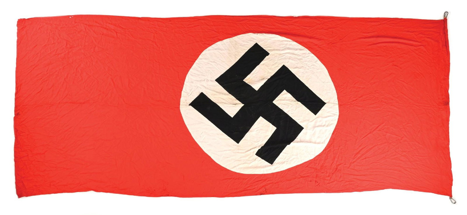 LARGE THIRD REICH NSDAP BANNER.: Large Third Reich double-sided NSDAP banner measuring 156" X 68" with several small holes and numerous scattered areas of moderate to heavy staining throughout. Flag is attached via 2 large metal