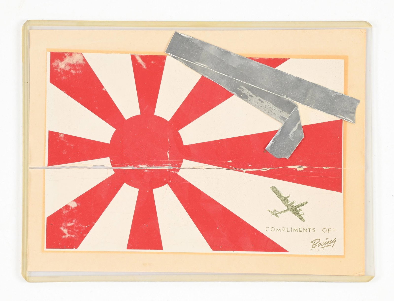 US WWII JAPANESE RISING SUN AIRCRAFT VICTORY DECAL.: Measures approximately 7" x 5". One tear through center. Marked "Compliments of Boeing". Numbered on reverse. Comes with a copy of a letter noting that this is for mounting on Boeing Superfortresses. 